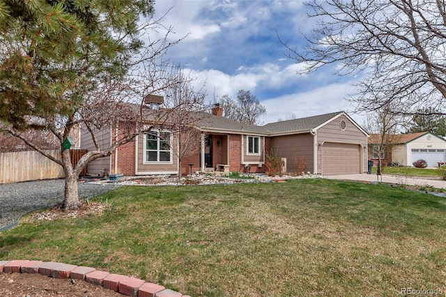 single story home with a garage and a front lawn