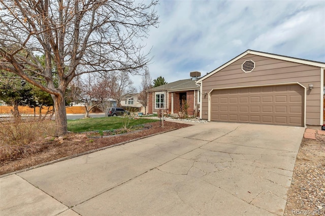 ranch-style home featuring a garage