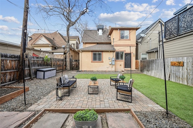 view of patio with a fenced backyard and a vegetable garden