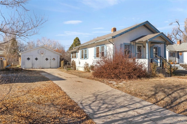 bungalow featuring an outbuilding