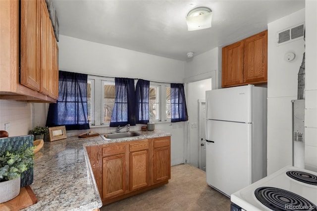 kitchen featuring sink and white appliances