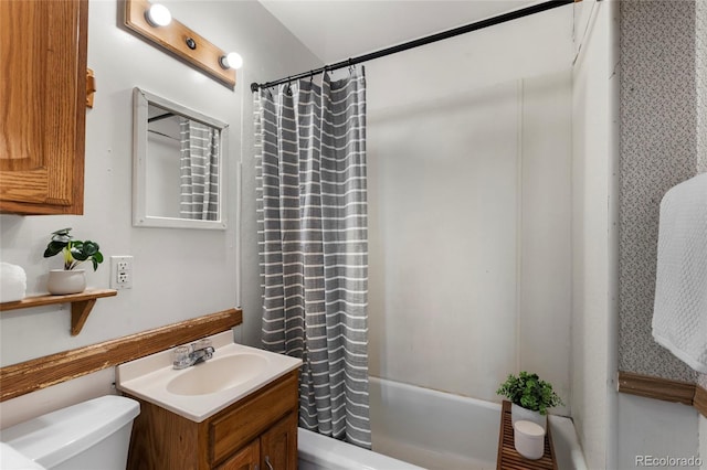 full bathroom featuring shower / tub combo, vanity, and toilet