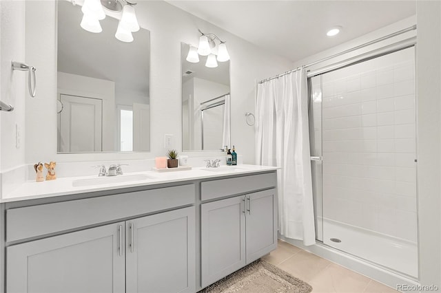 bathroom featuring curtained shower, tile patterned floors, and vanity