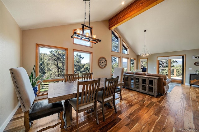26452 Wolverine Trl, Evergreen, CO 80439 - dining area with a chandelier, dark wood-style floors, beamed ceiling, healthy amount of natural light, and high vaulted ceiling