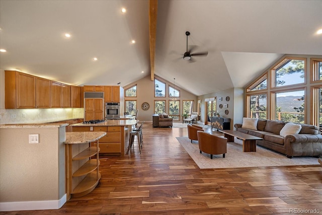 26452 Wolverine Trl, Evergreen, CO 80439 - living area featuring ceiling fan, dark wood-type flooring, baseboards, and recessed lighting