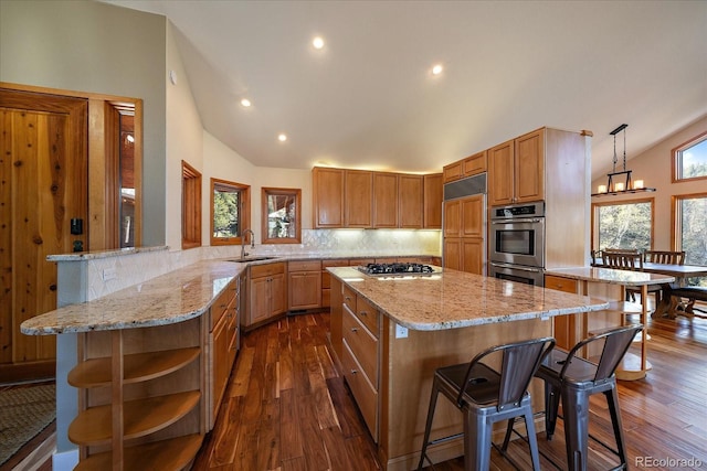 26452 Wolverine Trl, Evergreen, CO 80439 - kitchen with a sink, stainless steel appliances, open shelves, a breakfast bar, and healthy amount of natural light
