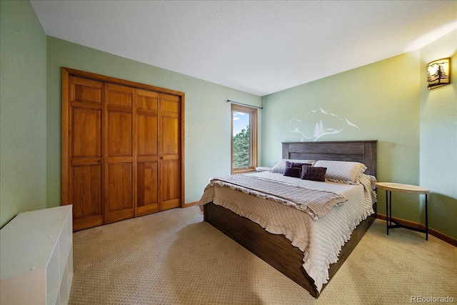 26452 Wolverine Trl, Evergreen, CO 80439 - bedroom featuring light carpet, baseboards, and a closet