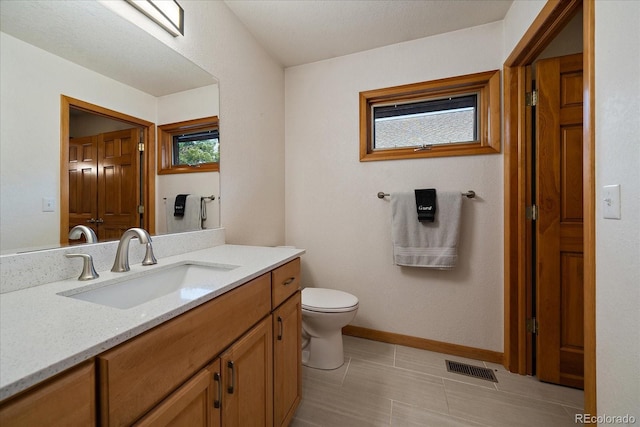 26452 Wolverine Trl, Evergreen, CO 80439 - bathroom with vanity, toilet, and baseboards