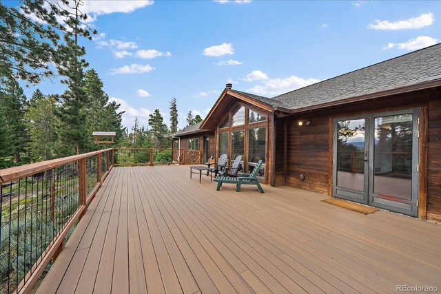 26452 Wolverine Trl, Evergreen, CO 80439 - wooden terrace with french doors