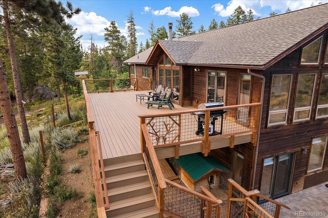 26452 Wolverine Trl, Evergreen, CO 80439 - wooden deck featuring stairs and area for grilling