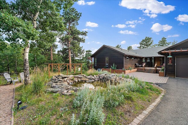 26452 Wolverine Trl, Evergreen, CO 80439 - view of yard with a wooden deck