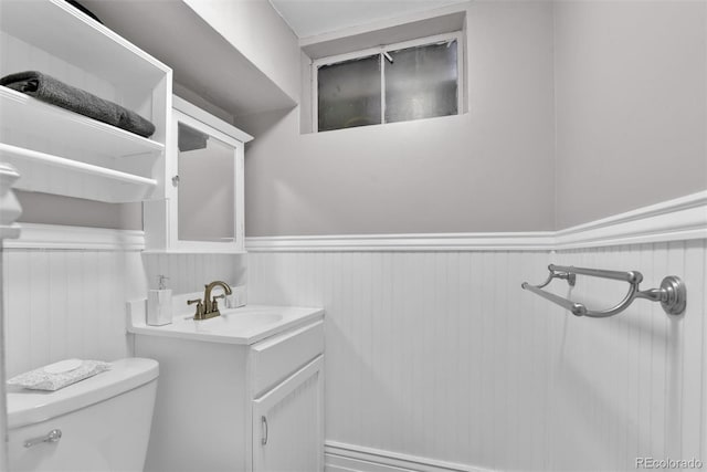 bathroom featuring toilet and vanity