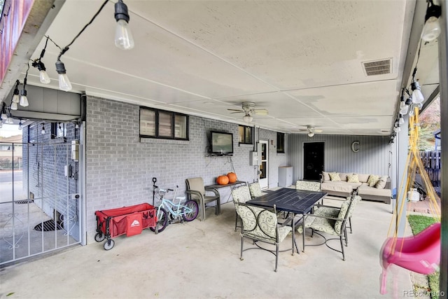 view of patio / terrace featuring outdoor dining area, ceiling fan, visible vents, and an outdoor hangout area