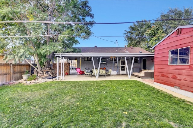 rear view of property with a patio, a yard, and outdoor lounge area