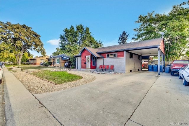 ranch-style house featuring a carport