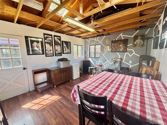 dining room with dark wood-style floors and beamed ceiling