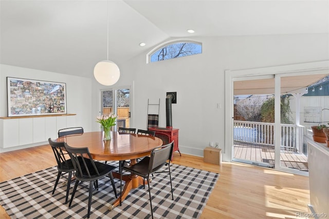 dining space featuring lofted ceiling, recessed lighting, baseboards, and wood finished floors