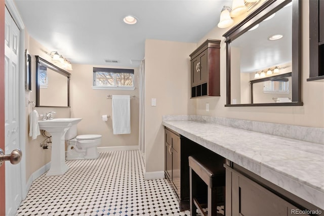 bathroom featuring recessed lighting, baseboards, visible vents, and toilet