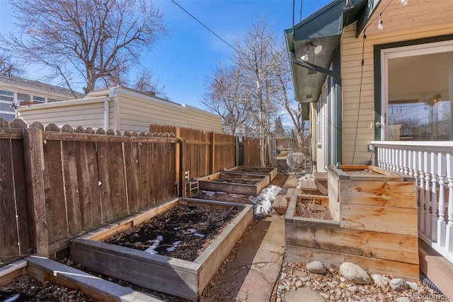 view of yard featuring a fenced backyard and a vegetable garden