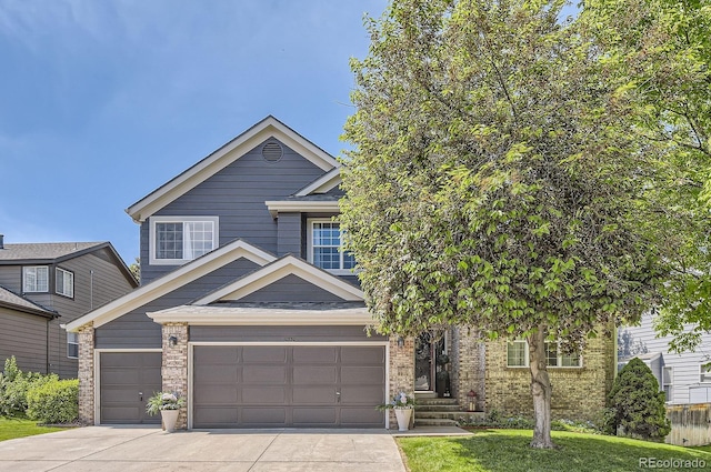 10330 Lions Path, Lone Tree, CO 80124 - view of front of house featuring concrete driveway, brick siding, and a garage