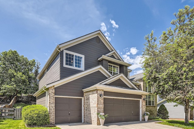10330 Lions Path, Lone Tree, CO 80124 - view of front facade featuring a garage, driveway, and brick siding