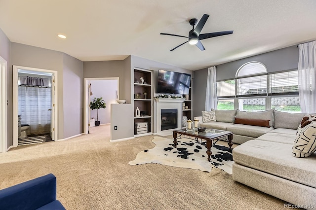 10330 Lions Path, Lone Tree, CO 80124 - carpeted living room with ceiling fan, a glass covered fireplace, baseboards, and recessed lighting