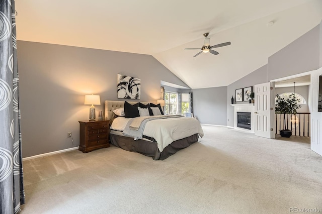 10330 Lions Path, Lone Tree, CO 80124 - carpeted bedroom featuring vaulted ceiling, baseboards, a glass covered fireplace, and ceiling fan