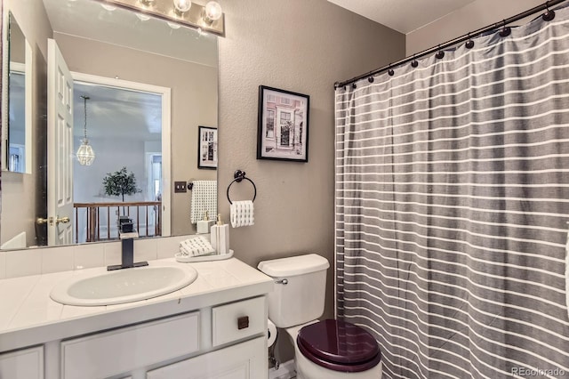 10330 Lions Path, Lone Tree, CO 80124 - bathroom featuring toilet, vanity, a textured wall, and a shower with curtain
