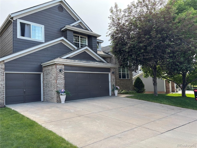 10330 Lions Path, Lone Tree, CO 80124 - view of front of home with an attached garage, driveway, and brick siding