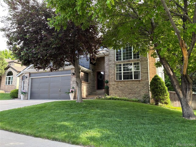 10330 Lions Path, Lone Tree, CO 80124 - view of property hidden behind natural elements featuring a garage, concrete driveway, and brick siding