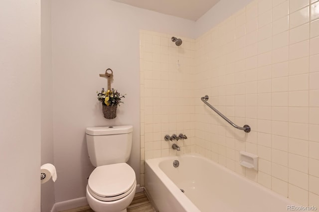 7665 E Eastman Ave Unit 111A, Denver, CO 80231 - bathroom featuring toilet, shower / washtub combination, and baseboards
