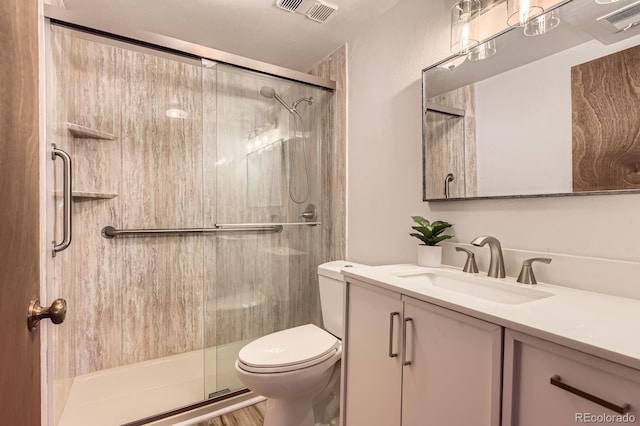 7665 E Eastman Ave Unit 111A, Denver, CO 80231 - bathroom featuring toilet, a shower stall, and vanity
