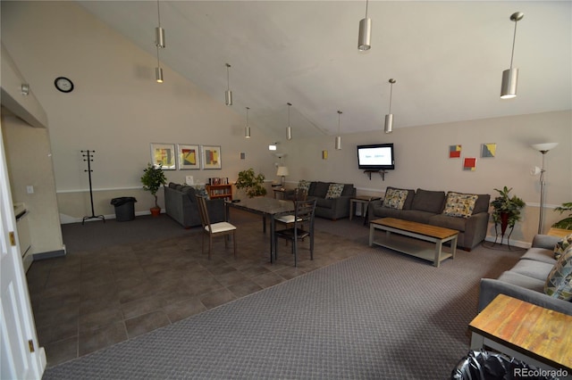 7665 E Eastman Ave Unit 111A, Denver, CO 80231 - living area featuring baseboards and high vaulted ceiling