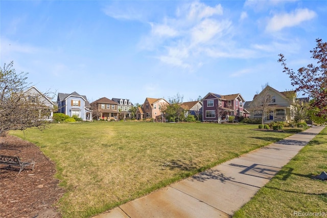 exterior space featuring a yard and a residential view