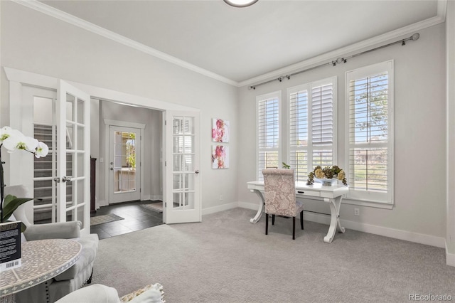 carpeted office space featuring french doors, baseboards, and ornamental molding