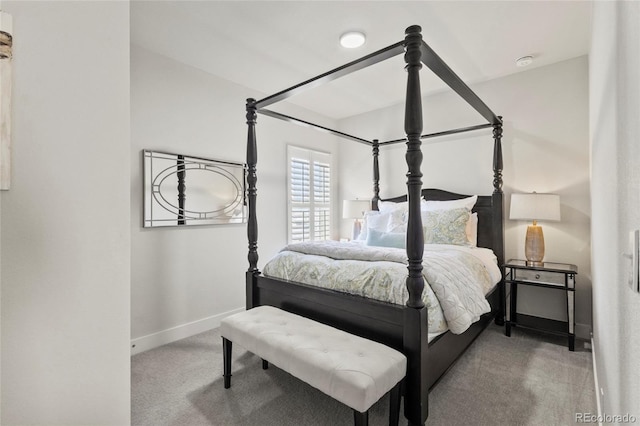carpeted bedroom featuring baseboards