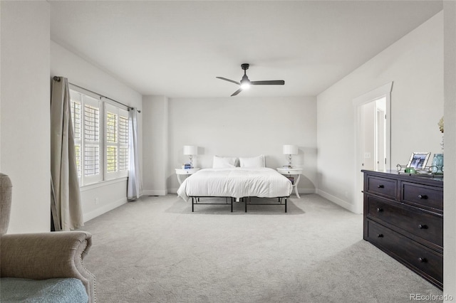 bedroom with baseboards, ceiling fan, and carpet floors