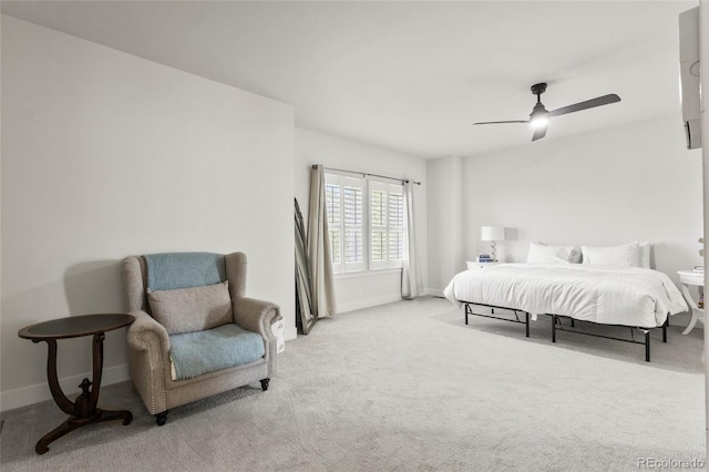 carpeted bedroom with baseboards and ceiling fan