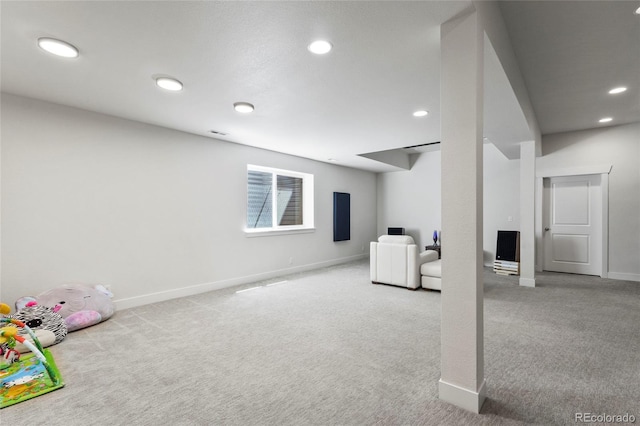 basement featuring baseboards, recessed lighting, and carpet floors