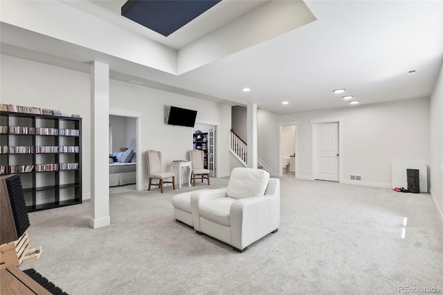living room featuring carpet floors, stairway, baseboards, visible vents, and recessed lighting