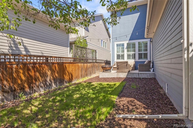 view of yard featuring a fenced backyard, a patio area, and outdoor lounge area