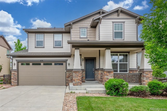676 Fossil Bed Cir, Erie, CO 80516 - craftsman house featuring stone siding, concrete driveway, an attached garage, and covered porch