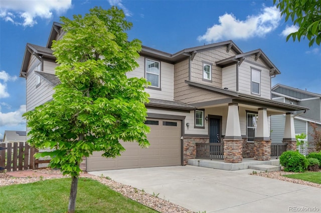 676 Fossil Bed Cir, Erie, CO 80516 - craftsman-style house featuring a porch, concrete driveway, an attached garage, and stone siding