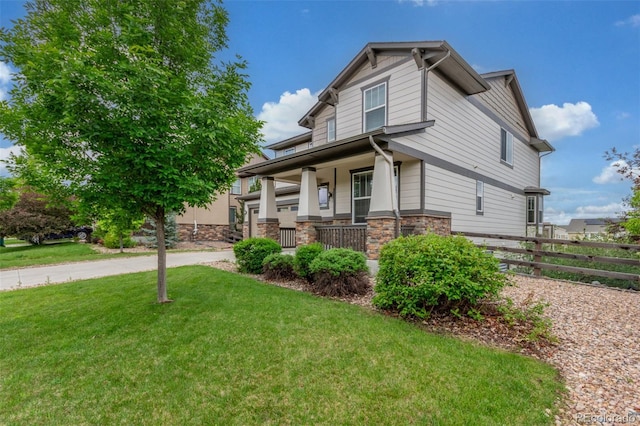 676 Fossil Bed Cir, Erie, CO 80516 - craftsman house featuring covered porch, stone siding, and driveway