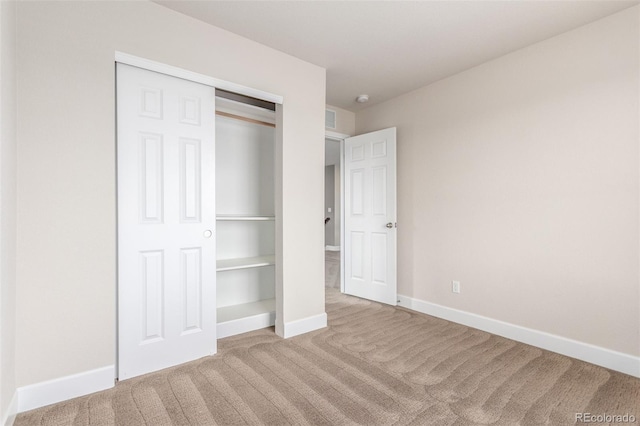 676 Fossil Bed Cir, Erie, CO 80516 - unfurnished bedroom with carpet flooring, baseboards, and a closet