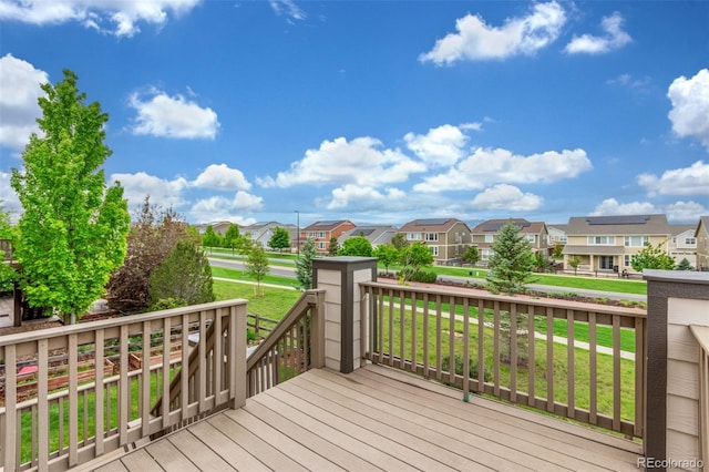 676 Fossil Bed Cir, Erie, CO 80516 - wooden deck featuring a residential view and a yard