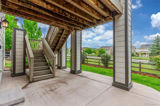 676 Fossil Bed Cir, Erie, CO 80516 - view of patio featuring stairway and a residential view