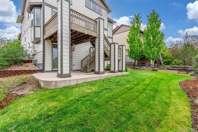 676 Fossil Bed Cir, Erie, CO 80516 - rear view of property featuring stairway, a patio, and a wooden deck
