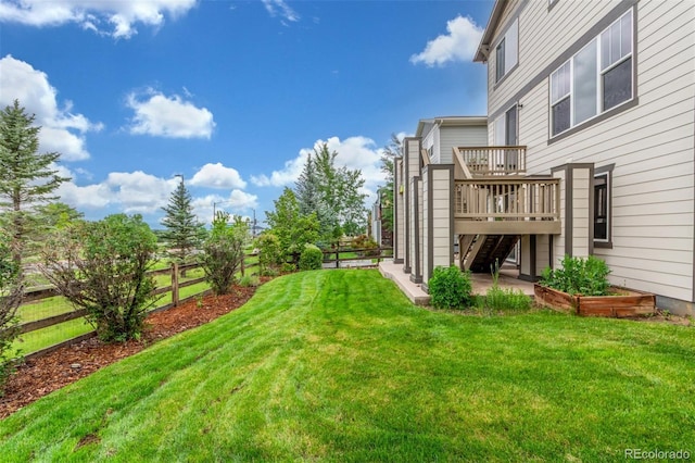 676 Fossil Bed Cir, Erie, CO 80516 - view of yard featuring a wooden deck and stairway