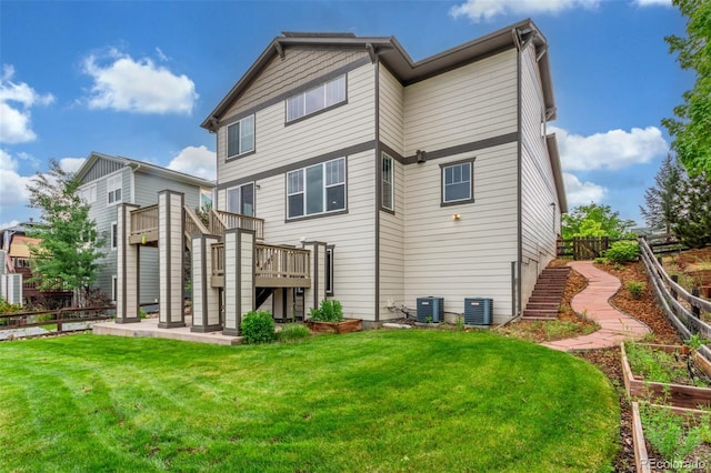676 Fossil Bed Cir, Erie, CO 80516 - rear view of property featuring a wooden deck and central AC